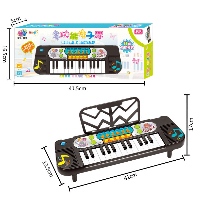 Children's toy keyboard with packaging displaying dimensions