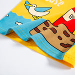 Children's shorts with cartoon design of a house and bird on a yellow background